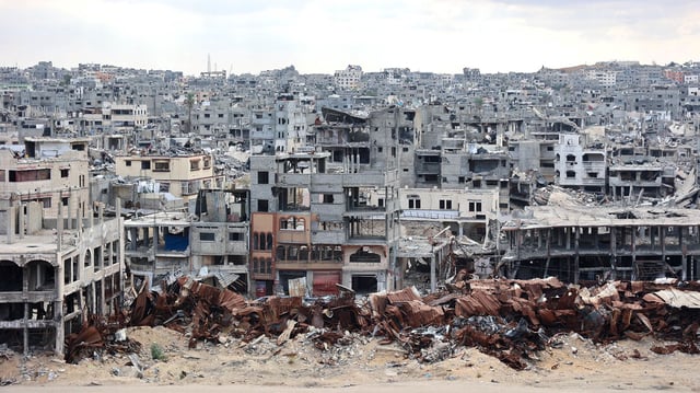 TOPSHOT - A picture shows a view of the destruction in the Shujaiya neighbourhood of Gaza City on October 7, 2024, on the first anniversary of the ongoing war in the Gaza Strip between Israel and the Palestinian Hamas group. (Photo by Omar AL-QATTAA / AFP) (Photo by OMAR AL-QATTAA/AFP via Getty Images)