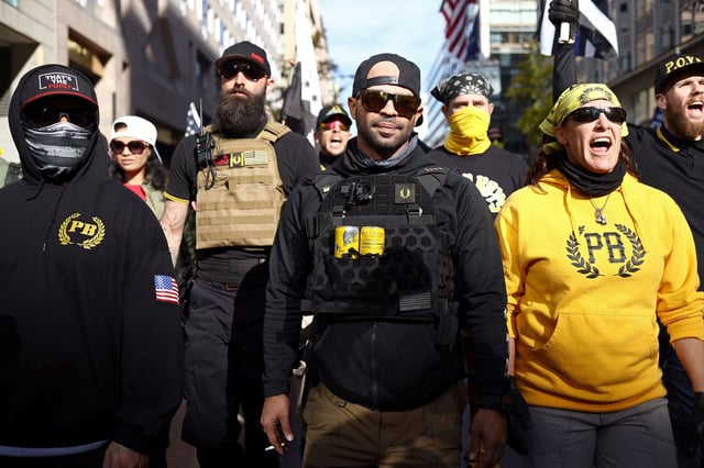 Members of the far-right Proud Boys, including leader Enrique Tarrio, center, rally in support of President Donald Trump to protest against the results of the 2020 presidential election, in Washington, DC, in November 2020.