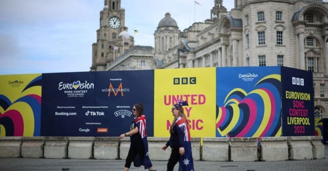 Eurovision fans wearing Australian flags, walk near the fanzine as part of the Eurovision celebrations in Liverpool, Britain May 9, 2023. REUTERS/Phil Noble