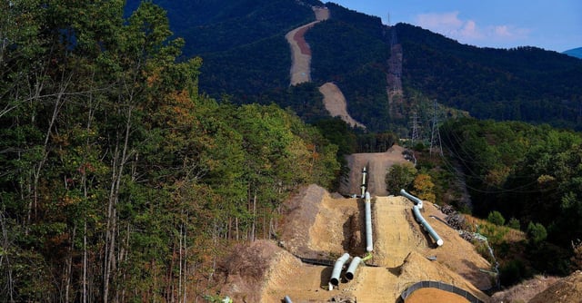 Lengths of pipe wait to be laid in the ground along the under-construction Mountain Valley Pipeline near Elliston, Virginia, U.S. September 29, 2019. REUTERS/Charles Mostoller