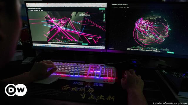 A symbolic image shows monitoring of global cyber attacks.