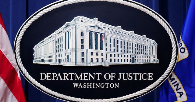 A U.S. Justice Department logo or seal showing Justice Department headquarters, known as "Main Justice," is seen behind the podium in the Department's headquarters briefing room before a news conference with the Attorney General in Washington, January 24, 2023.  REUTERS/Kevin Lamarque/