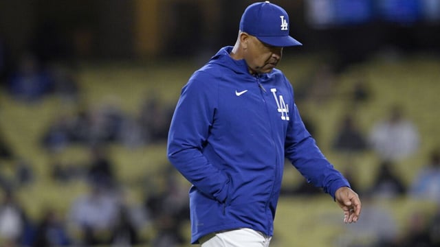 Los Angeles Dodgers manager Dave Roberts walks back to the dugout after making a pitching change during the ninth inning of the team's baseball game against the Chicago White Sox in Los Angeles, Wednesday, June 14, 2023. (AP Photo/Alex Gallardo)