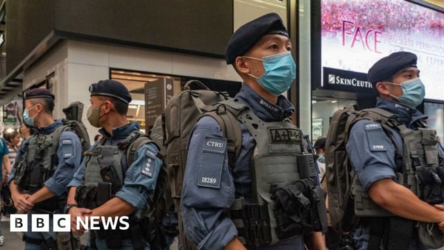 Counter Terrorism Response Unit stand guard at Causeway Bay near Victoria Park on June 04, 2023 in Hong Kong, China