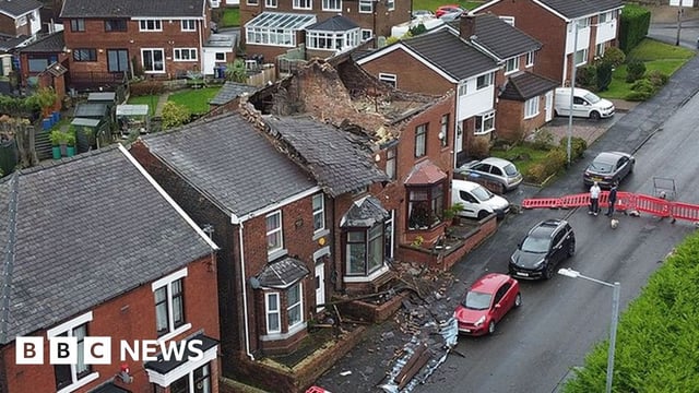 Aerial photograph of a house which had its roof ripped off during a localized tornado