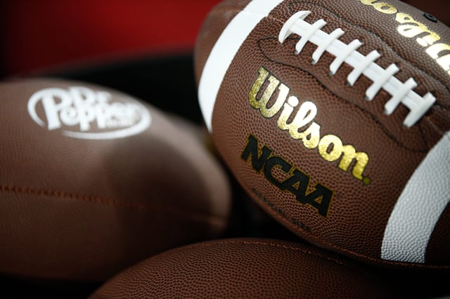 CHARLOTTE, NORTH CAROLINA - DECEMBER 2: The Wilson and NCAA Logo is shown on a football as the Louisville Cardinals take on the Florida State Seminoles during the ACC Championship at Bank of America Stadium on December 2, 2023 in Charlotte, North Carolina.