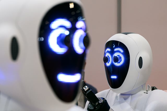 A pair of 1X androids are displayed