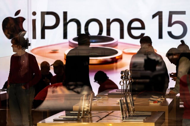 Shoppers inside an Apple Store in Walnut Creek, California, on December 20, 2023. Apple’s stock was hit by two ratings downgrades ahead of the company’s December-quarter earnings report. Photo: Bloomberg