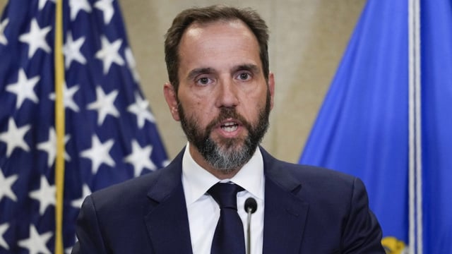 FILE – Special counsel Jack Smith speaks to the media about an indictment of former President Donald Trump, Aug. 1, 2023, at an office of the Department of Justice in Washington. A slim majority of Americans approve of the U.S. Justice Department indicting Donald Trump over his efforts to remain in office after losing the 2020 election, according to a new poll from The Associated Press-NORC Center for Public Affairs Research. (AP Photo/J. Scott Applewhite, File)