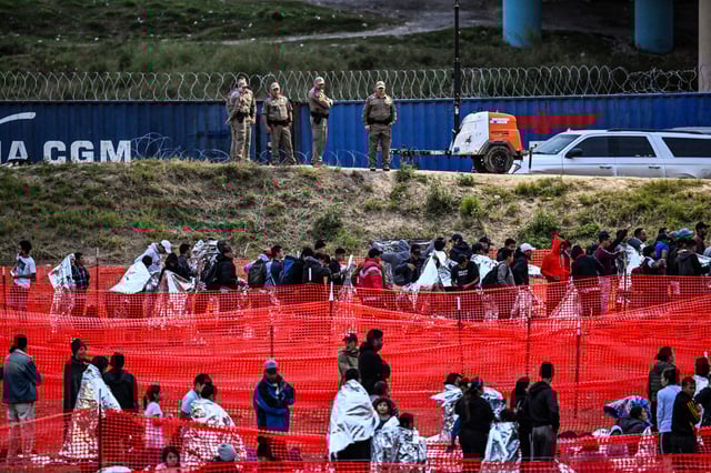 Customs and Border Protection agents at a U.S. Border Patrol transit center after immigrants crossed the border from Mexico in Eagle Pass, Texas, on Dec. 22, 2023. 