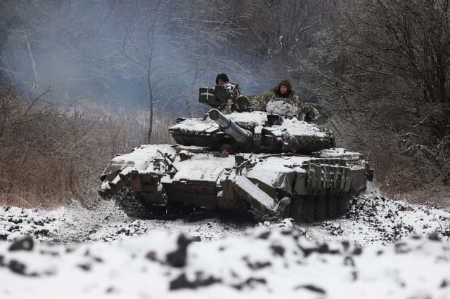 Ukrainian soldiers drive a tank near the town of Bakhmut on December 13, 2023. February 24 will mark the two-year anniversary of Russia's full-scale invasion, with no immediate end in sight.