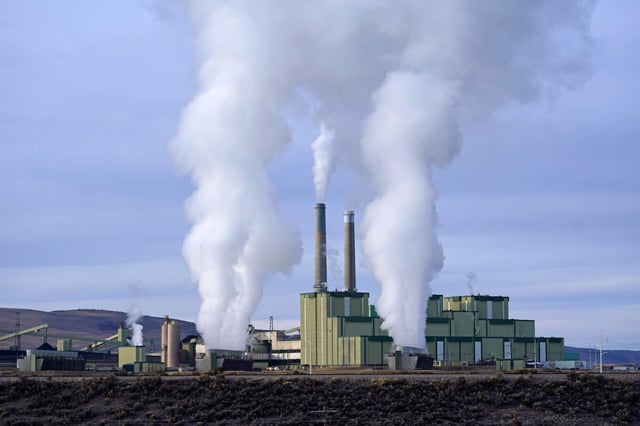 Steam billows from a coal-fired power plant Nov. 18, 2021, in Craig, Colo.