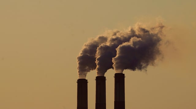 Emissions rise from the smokestacks at the Jeffrey Energy Center coal power plant as the suns sets Saturday, Sept. 18, 2021, near Emmett, Kan. (AP Photo/Charlie Riedel)