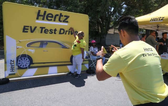 Guests attend as Hertz kicks off one of the country’s largest electric vehicle test drives at the company’s Los Angeles International Airport location on July 19, 2023 in Los Angeles, California. Drivers had the chance to test drive an EV and see the newest EV models showcased by Tesla, Chevrolet, Polestar, and Kia. Additional in-person test drives are being planned at Hertz locations across the U.S. later this year.
