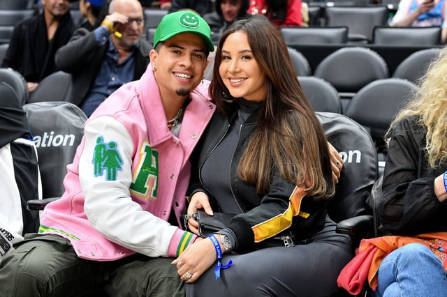 Austin McBroom and Catherine Paiz attend a basketball game between the Los Angeles Clippers and the Boston Celtics at Crypto.com Arena, in Los Angeles, on Dec. 12, 2022.