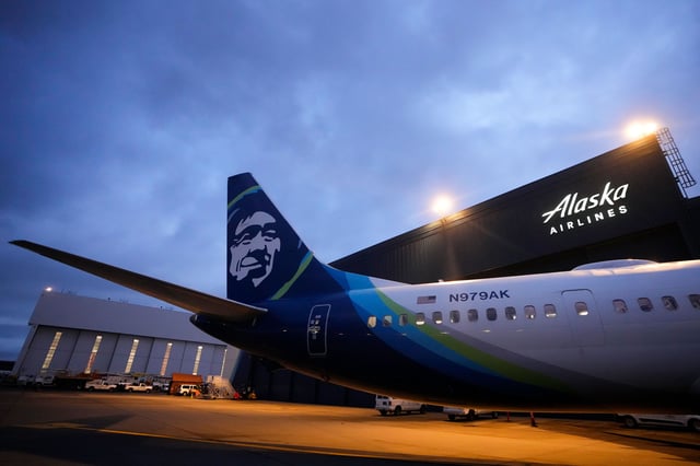 An Alaska Airlines Boeing 737 Max 9 with a door plug aircraft awaits inspection at the airline's hangar at Seattle-Tacoma International Airport Wednesday, Jan. 10, 2024, in SeaTac, Wash. On a Jan. 5 Alaska Airlines flight, a panel used to plug an area reserved for an exit door blew open midair, forcing it to return to Portland. (AP Photo/Lindsey Wasson)