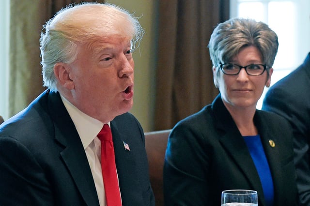 Sen. Joni Ernst, R-Iowa, listens as President Donald Trump speaks in the Cabinet Room of the White House in 2017.