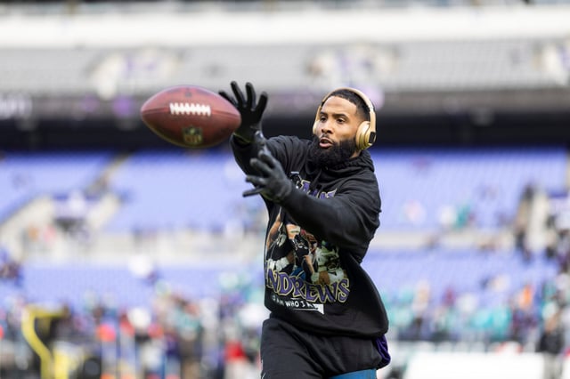 Odell Beckham Jr. #3 of the Baltimore Ravens completes a pass as he warms up prior to an NFL football game between the Baltimore Ravens and the Miami Dolphins at M&T Bank Stadium on December 31, 2023 in Baltimore, Maryland.