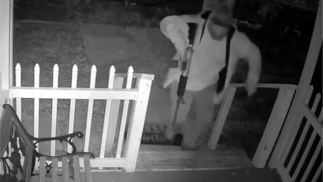 Eric Proctor was seen on surveillance footage threatening a driver with an AR-15.