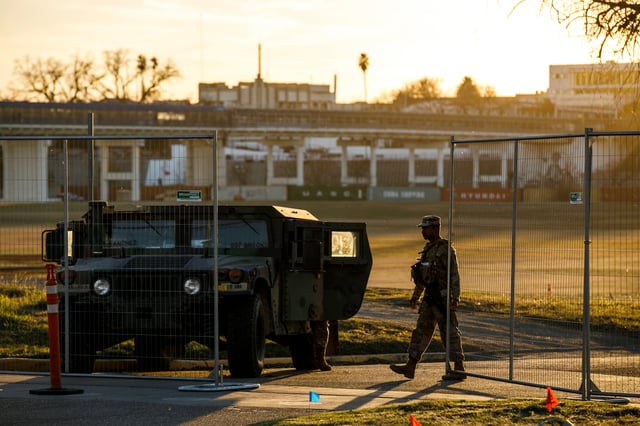 Texas Department of Public Safety officers guard an entrance to Shelby Park on Thursday, Jan. 11, 2024, in Eagle Pass, Texas. The Justice Department on Friday, Jan. 12, asked the Supreme Court to order Texas to stop blocking Border Patrol agents from a portion of the U.S.-Mexico border where large numbers of migrants have crossed in recent months, setting up another showdown between Republican Gov. Greg Abbott and the Biden administration over immigration enforcement. (Sam Owens /The San Antonio Express-News via AP)