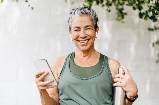 A healthy senior woman preparing to exercise