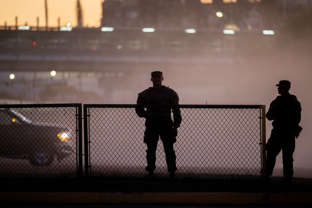 National Guard soldiers stand guard on the banks of the Rio Grande river at Shelby Park on January 12, 2024 in Eagle Pass, Texas. The Texas National Guard continues its blockade and surveillance of Shelby Park in an effort to deter illegal immigration. The Department of Justice has accused the Texas National Guard of blocking Border Patrol agents from carrying out their duties along the river. (Photo by Brandon Bell/Getty Images)