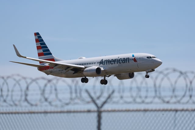 A former American Airline flight attendant has been accused of filming girls inside aircraft lavatories while working as a crew member, prosecutors said.