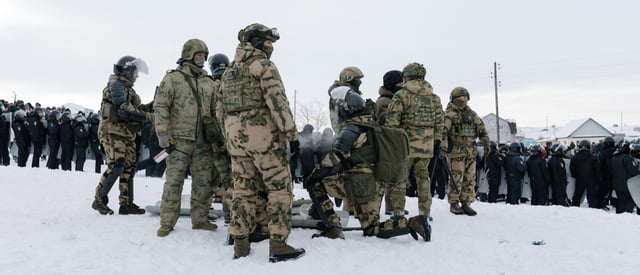 Riot policemen are seen deployed to disperse protesters in the town of Baymak in Russia's central Bashkortostan region on January 17, 2024, after a court sentenced a local activist to four years in prison. Fail Alsynov, who campaigns against gold mining in the Urals region and advocates for the protection of the large ethnic Bashkir population's language, was sentenced for "inciting hatred" in the town of Baymak. (Photo by Anya Marchenkova / AFP) (Photo by ANYA MARCHENKOVA/AFP via Getty Images)