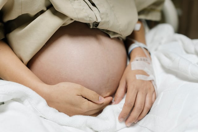 Close up Belly of Asian mother pregnant 40 weeks ready to give birth