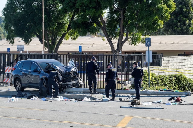 Law enforcement investigate the scene after multiple Los Angeles County Sheriff's Department recruits were injured when a car crashed into them while they were out for a run in Whittier, California, U.S. November 16, 2022. REUTERS/Ringo Chiu