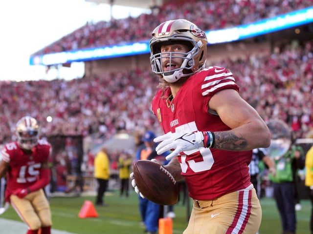 George Kittle celebrates scoring a touchdown with the San Francisco 49ers.
