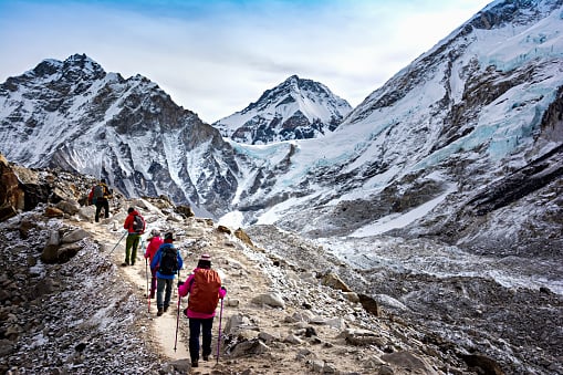 Hikers walk to Everest Base Camp during Everest Base Camp trekking in Nepal.