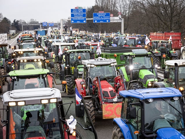 STRASBOURG, FRANCE - JANUARY 30: Farmers take part in a protest called by local branches of major farmer unions FNSEA and Jeunes Agriculteurs, blocking the A35 highway with tractors near Strasbourg, France, on January 30, 2024. Protests continue nationwide, called by several farmers unions on pay, tax and regulations. (Photo by Sathiri Kelpa/Anadolu via Getty Images)