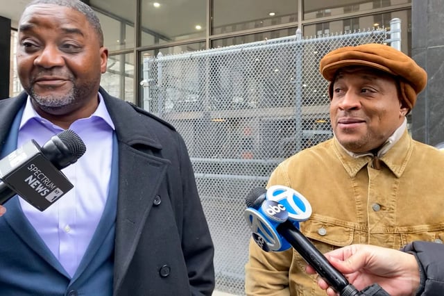 David Warren, right, and Eric Smokes celebrate their overturned convictions outside a Manhattan courthouse Wednesday.