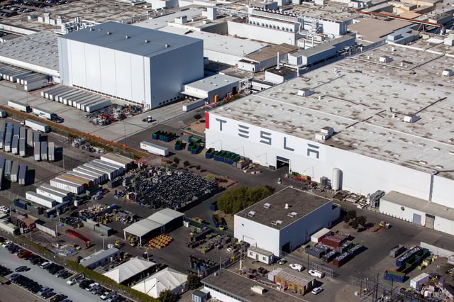 The Tesla Inc. assembly plant stands in this aerial photograph taken above Fremont, California, U.S., on Wednesday, Oct. 23, 2019. Tesla shares are trading above Wall Street expectations after spending most of the year languishing below analysts' average price targets. Photographer: Sam Hall/Bloomberg