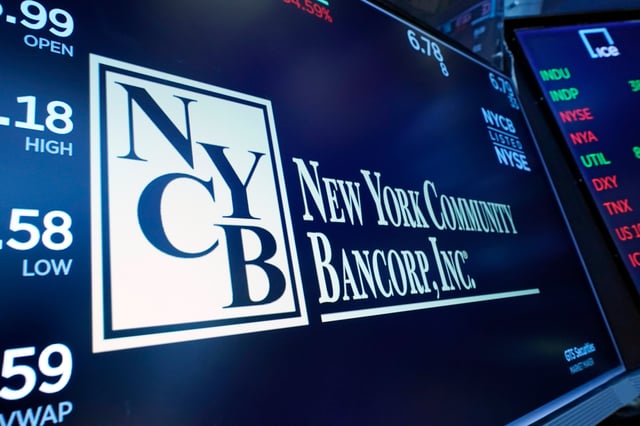 The logo for New York Community Bancorp is displayed above a trading post on the floor of the New York Stock Exchange, Wednesday, Jan. 31, 2024. New York Community Bancorp Inc. on Wednesday reported a loss of $252 million in its fourth quarter.