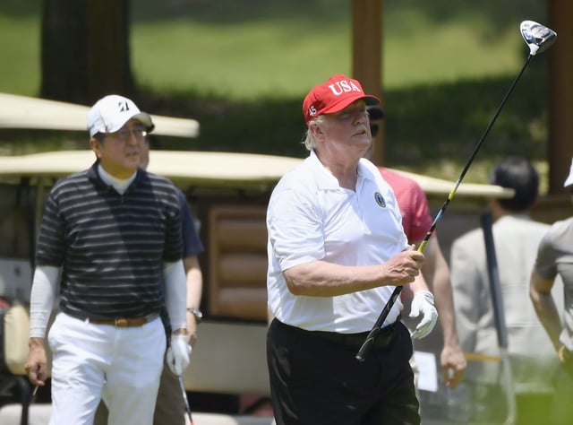 US President Donald Trump (right) and Japanese Prime Minister Shinzo Abe play golf in Chiba prefecture, near Tokyo, in 2019. Photo: Kyodo