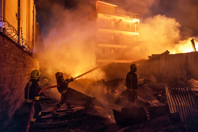 Firemen fight a blaze following a series of explosions in the Embakasi area of Nairobi, Kenya on February 2, 2024.