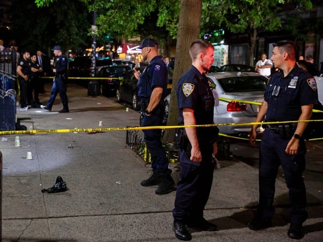 New York City Police Department (NYPD) officers investigate the scene where a women was shot and killed in the Brooklyn borough of New York, U.S., on Wednesday, August 4, 2021. New York Democratic mayoral nominee Eric Adams said after a meeting with President Joe Biden that the availability of handguns is driving increases in violent crime in the U.S., and that too much attention is paid to police practices. Photographer: Michael Nagle/Bloomberg
