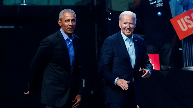 President Biden walks with former President Obama on Saturday, Nov. 5, 2022, in Philadelphia during a midterms campaign rally. (AP Photo/Matt Rourke)