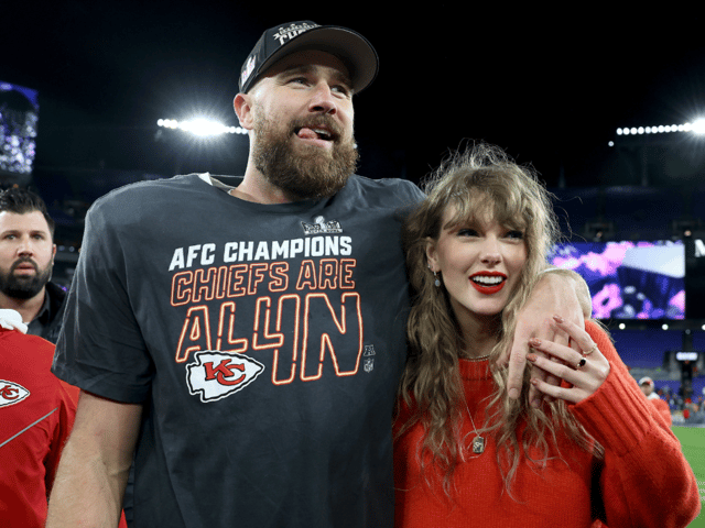 Travis Kelce (left) of the Kansas City Chiefs celebrates with Taylor Swift after a 17-10 victory against the Baltimore Ravens at M&T Bank Stadium on January 28, 2024 in Baltimore, Maryland. The singer joined her boyfriend on the field following the Chiefs' AFC Championship win.