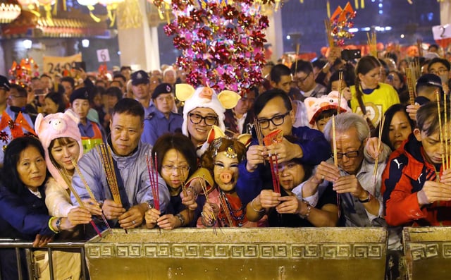 Worshippers offer incense at Wong Tai Sin Temple in Hong Kong on Lunar New Year’s Eve in 2019. Photo: Edmond So
