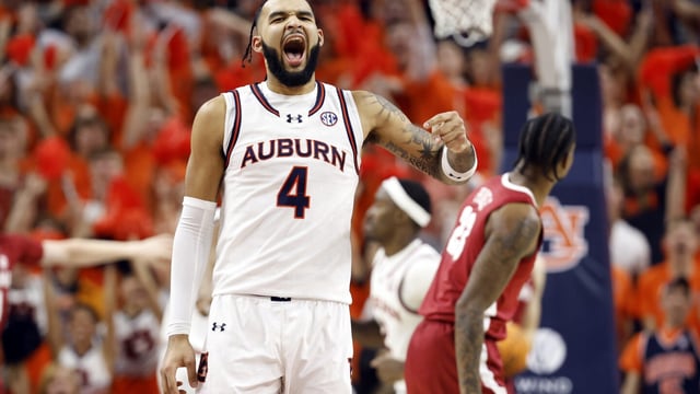 Auburn forward Johni Broome reacts after a basket during the first half of an NCAA college basketball game against the Alabama, Wednesday, Feb. 7, 2024, in Auburn, Ala. (AP Photo/ Butch Dill)