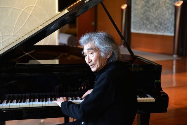 Japanese maestro Seiji Ozawa plays the piano during an interview at the French ambassador’s official residence in Tokyo on 8 April 2013. Photo: AFP