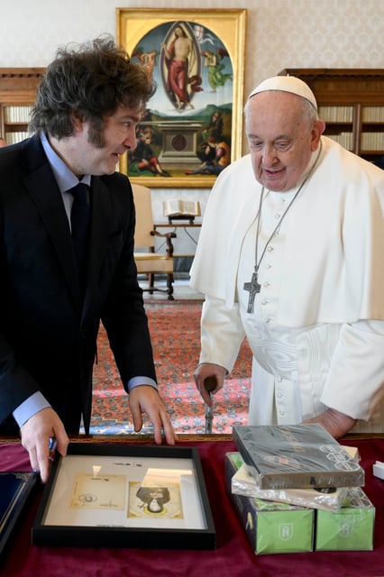 Argentine President Javier Milei presents Pope Francis with some gifts including Francis’ favourite Argentine dulce de leche, alfahore biscuits, and lemon biscuits. Photo: AP