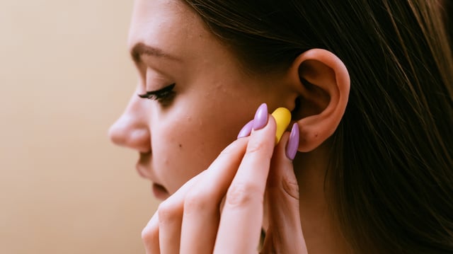 Wearing ear plugs in loud areas can help prevent hearing loss.