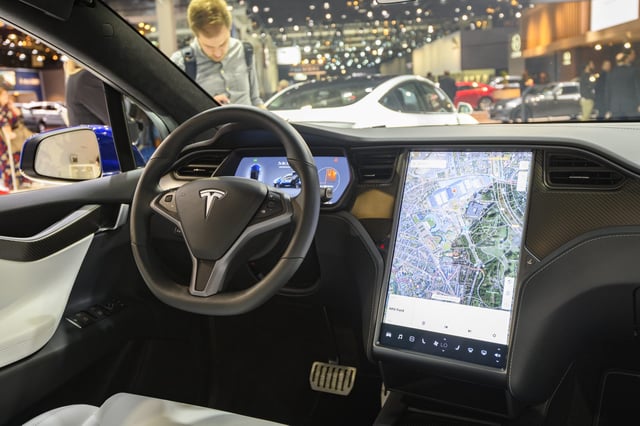 BRUSSELS, BELGIUM - JANUARY 09: Interior on a Tesla Model X full electric luxury crossover SUV car with a large touch screen and carbon look dashboard on display at Brussels Expo on January 9, 2020 in Brussels, Belgium. The Model X uses falcon wing doors for access to the second and third row seats. (Photo by Sjoerd van der Wal/Getty Images)