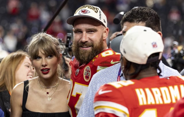 Travis Kelce #87 of the Kansas City Chiefs and Taylor Swift react as they see Mecole Hardman Jr. #12 of the Kansas City Chiefs following the NFL Super Bowl 58 football game between the San Francisco 49ers and the Kansas City Chiefs at Allegiant Stadium on February 11, 2024 in Las Vegas, Nevada (CREDIT: Michael Owens/Getty Images)