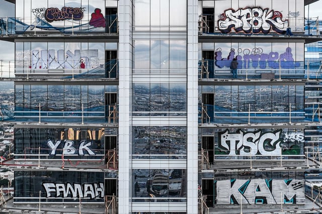 Oceanwide Plaza tower covered in graffiti on Feb. 1, 2024.