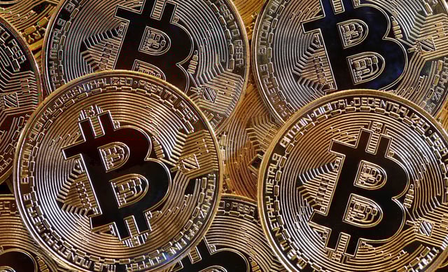 PARIS, FRANCE - FEBRUARY 13: In this photo illustration, a visual representation of the digital cryptocurrency Bitcoin is displayed on February 13, 2024 in Paris, France. Bitcoin crosses the $50,000 mark for the first time in two years. Bitcoin is the world's largest cryptocurrency and recently received approval from the US Securities and Exchange Commission to allow bitcoin exchange-traded funds. (Photo illustration by Chesnot/Getty Images)
